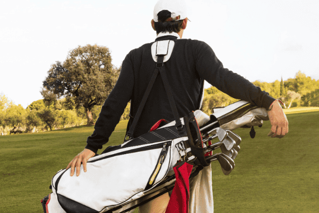 man with golf bag