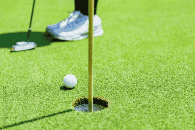 golf ball in the course near the hole