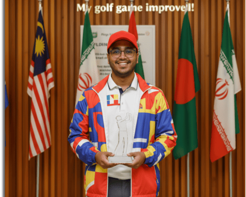 a man standing with trophy infront of the flags of different country