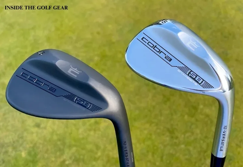 Two golf wedges on green grass